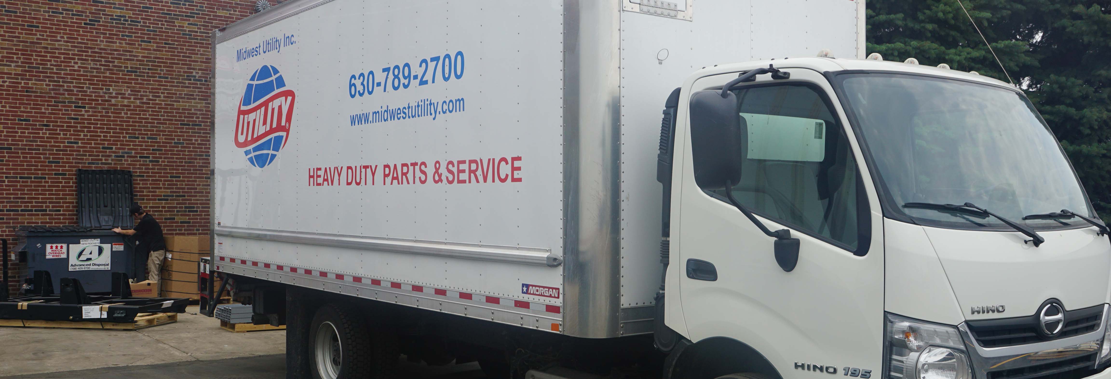 Technicians servicing a trailer
